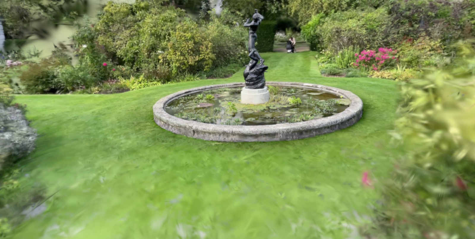 A garden fountain scene captured as a 3D Gaussian Splat in Polycam