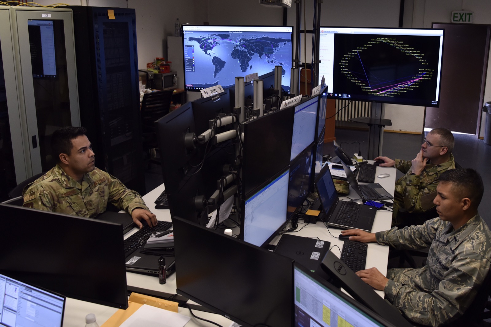 U.S. Air Force personnel working at computers during a cyber defense training exercise